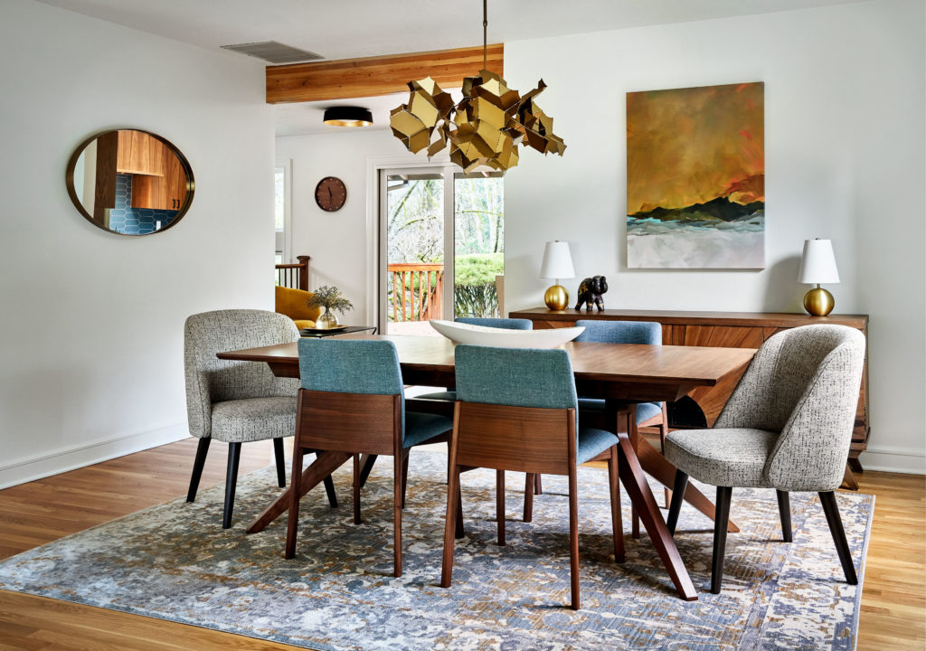 dining room with upholstered chairs and custom chandelier