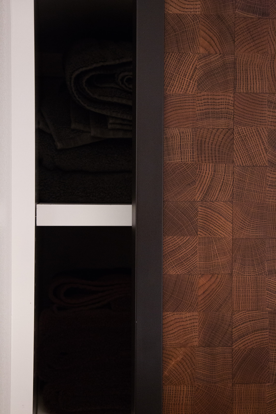 linen closet with end grain oak sliding doors