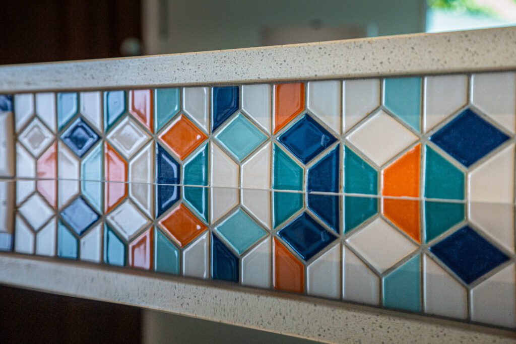 Closeup of colorful mosaic tile and quartz countertop